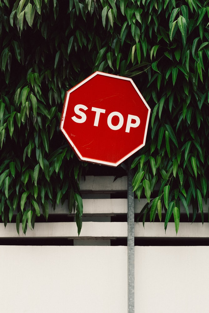 A stop sign that represents identifying when to say no and set healthy boundaries for yourself. Learn boundary setting in therapy in Katy, TX 77494