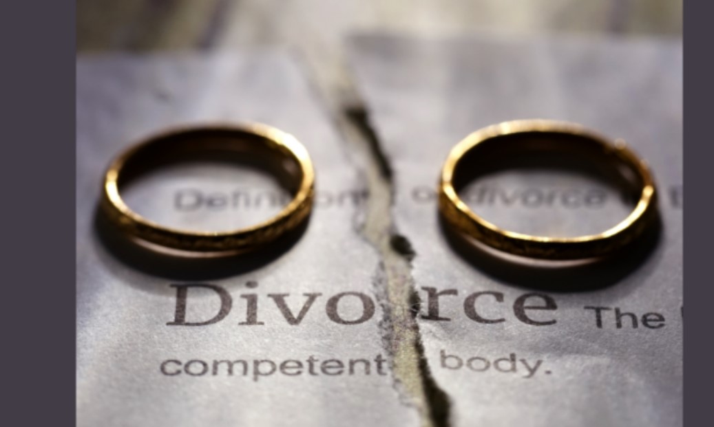 Two wedding rings on a piece of paper that says divorce that is torn to symbolize the dissolving of the marriage, begin counseling today, counseling center at cinco ranch, katy texas 77474, overcoming gray divorce, late-life divorce blog