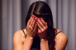 Girl covering her face in shame or sadness, Normalizing Arousal and Romantic Dreams after Sexual Assault blog, counseling center at cinco ranch, therapy in katy texas 77494