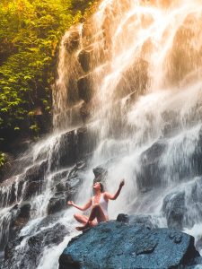 woman meditating by a waterfall, mindfullness meditation blog, reduce anxiety, counseling center at cinco ranch, katy texas 
