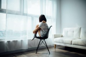 girl sitting on a chair all alone in a room, depression blog, signs to look for, counseling center at cinco ranch, katy texas 77494